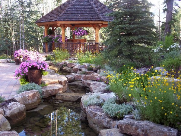 man made creek installation with gazeebo